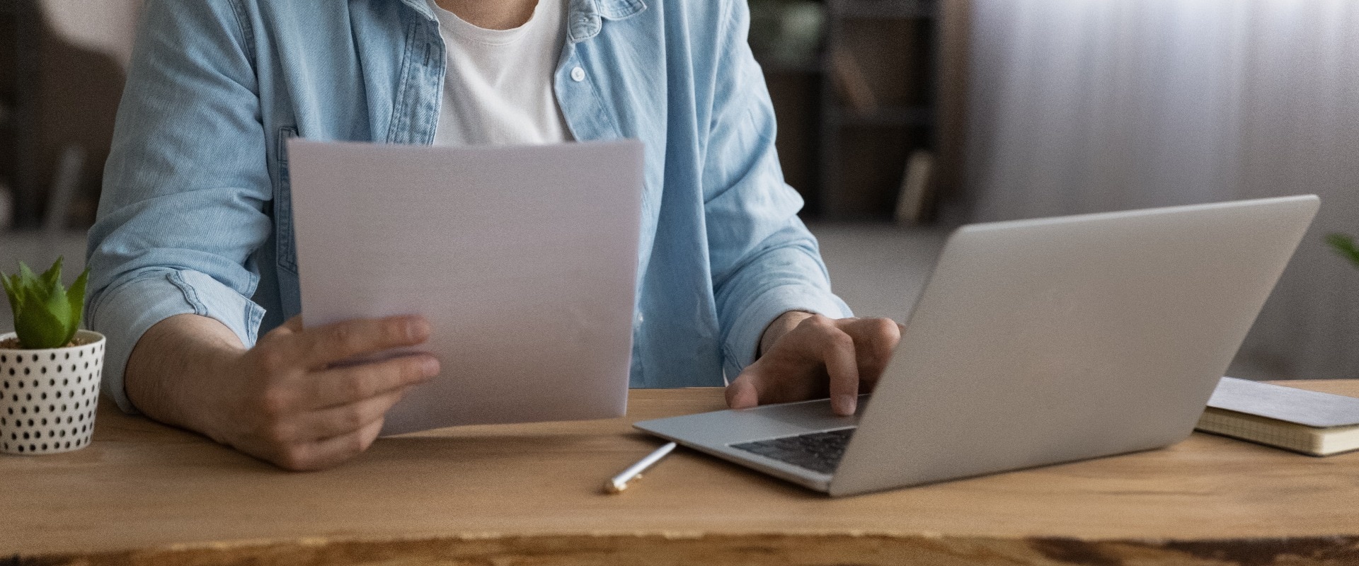 Focused businessman using laptop, looking at screen, serious man working with financial documents or correspondence, checking data, analyzing statistics, student busy with research project