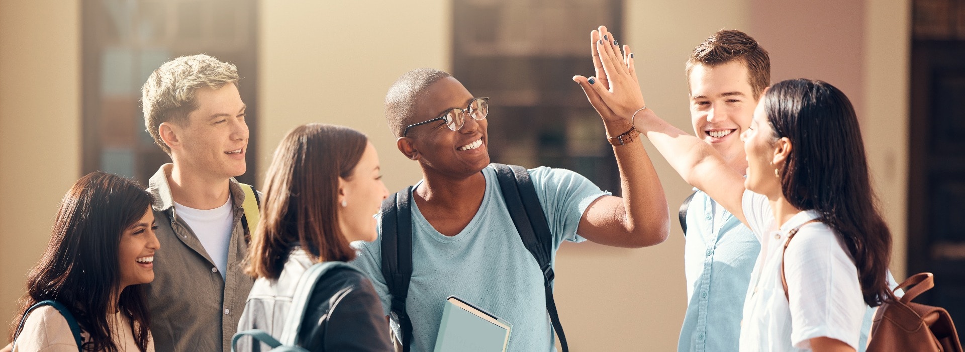 University, friends and student high five of diversity, college and education group outdoor. Students, study and success support hand gesture of people with happiness excited about learning goal